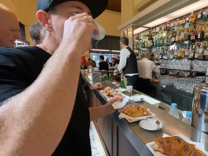 australian men drink coffee in bar